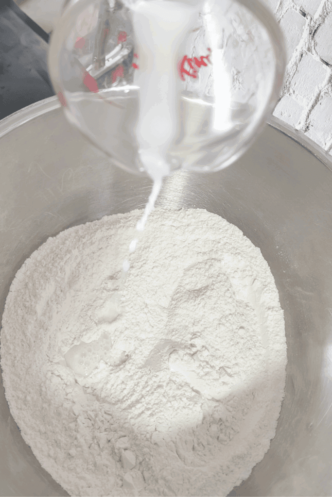 adding baking soda water to flour
