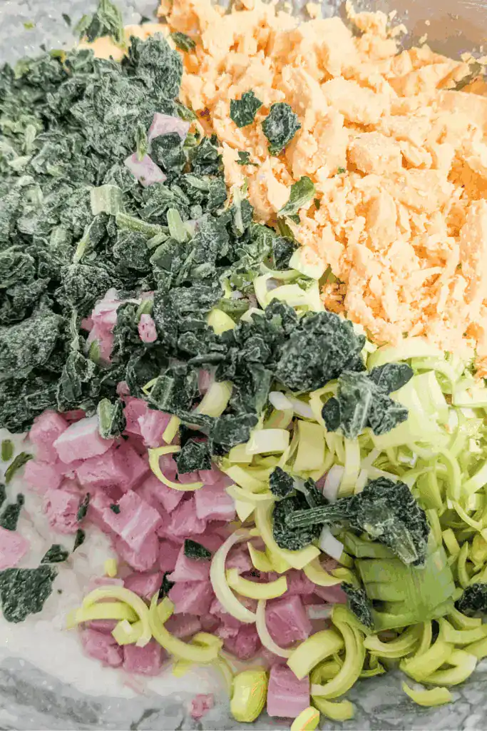 adding frozen spinach to the mixture
