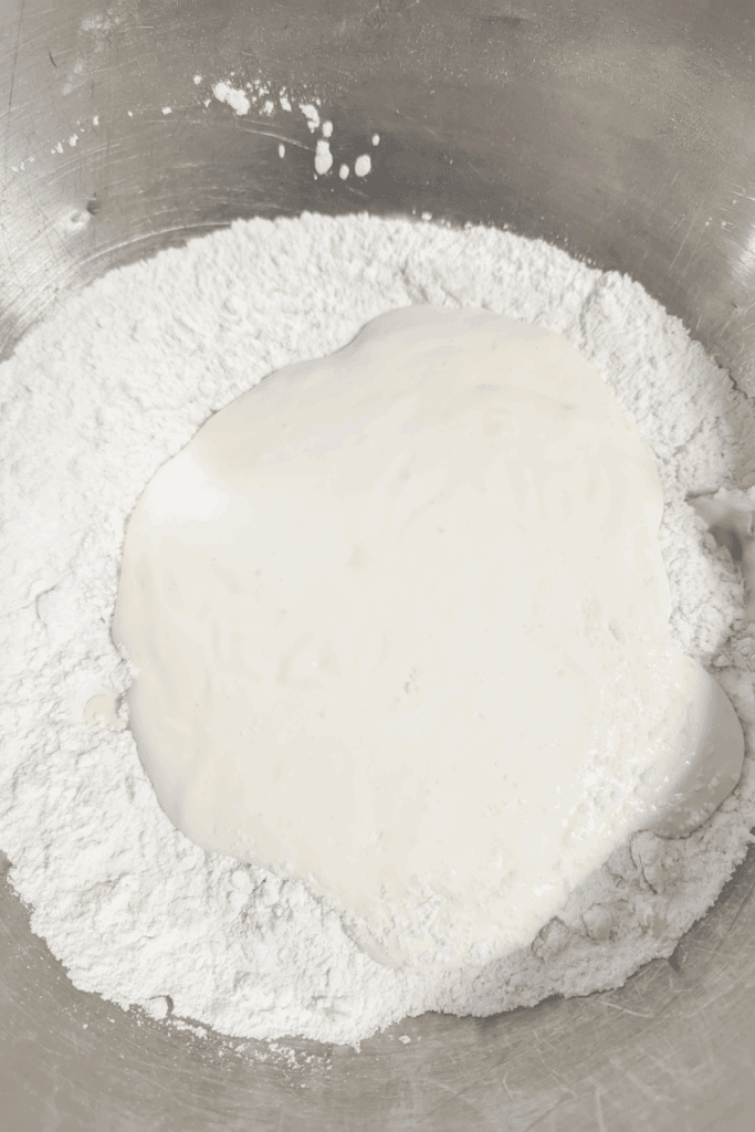 adding sourcream egg to flour