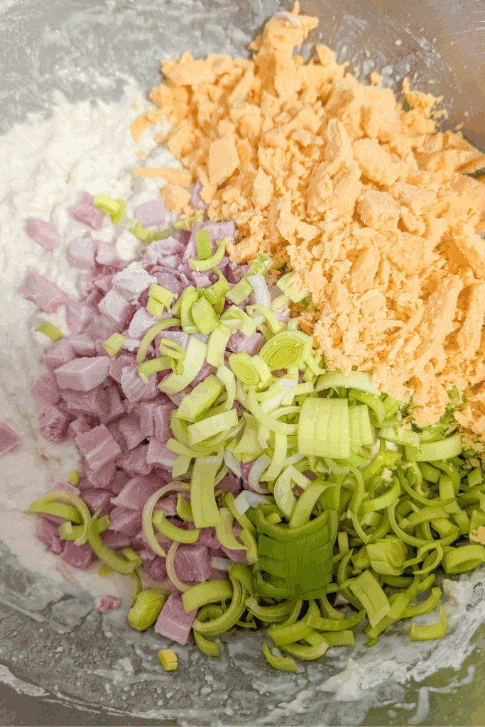 adding the crumbled orange cheese