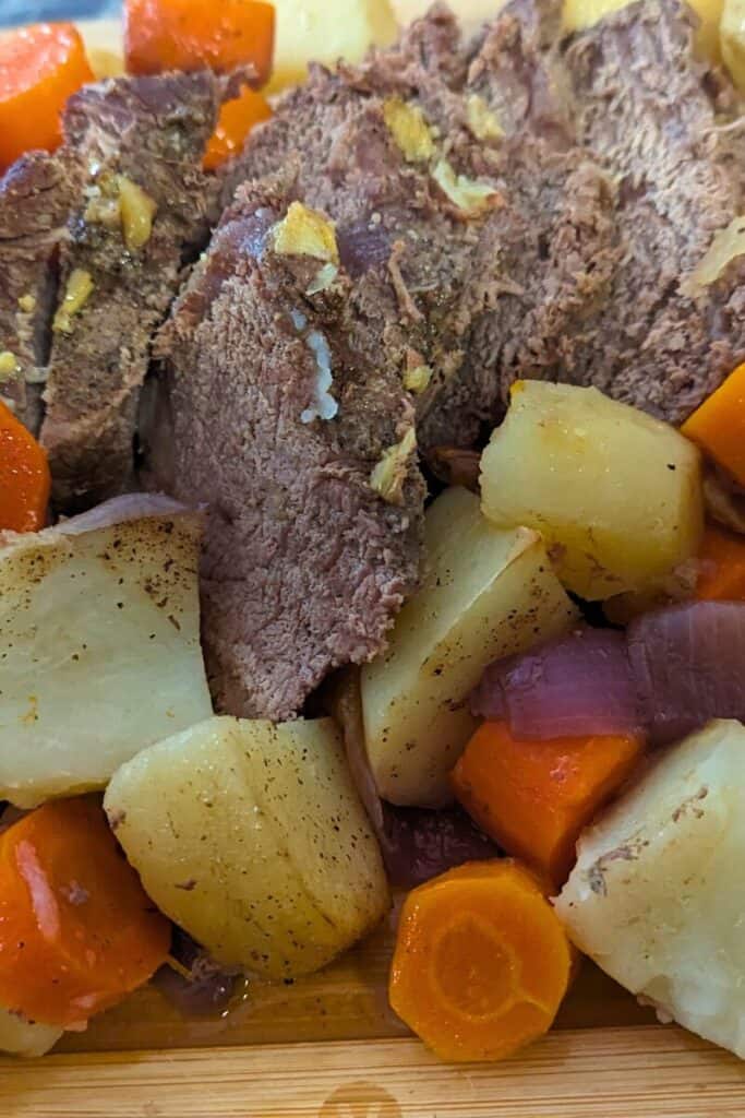 cooked roast beef and potato and carrot