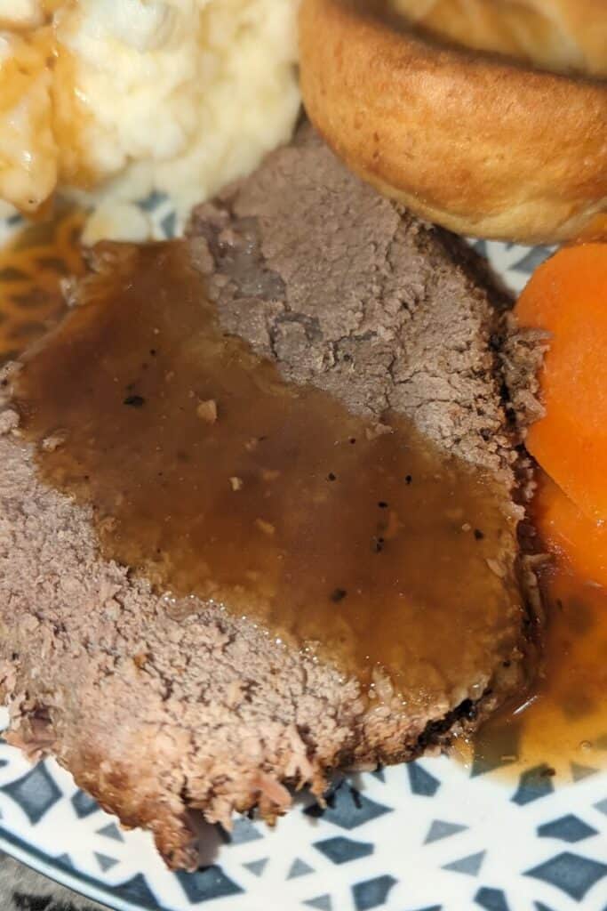 garlic roast beef covered in gravy