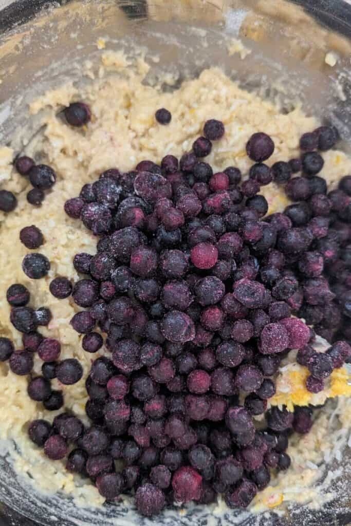 adding wild frozen blueberries to cookie dough
