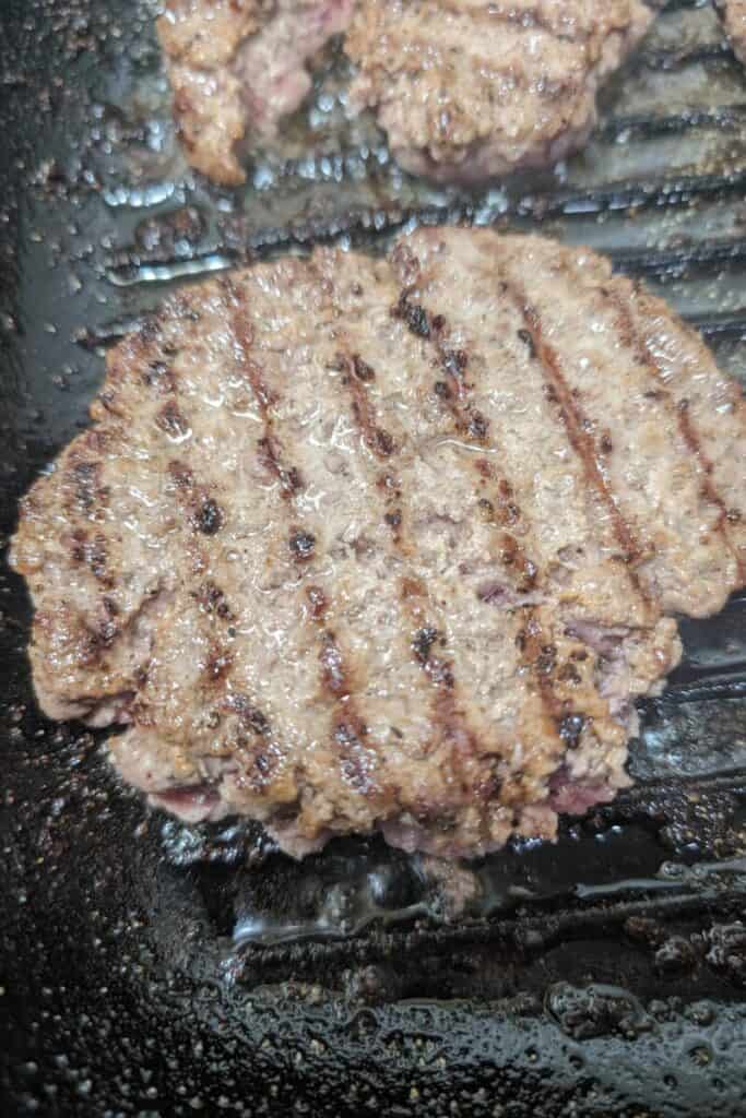 flip burger in grill pan on opposing direction for best grill marks