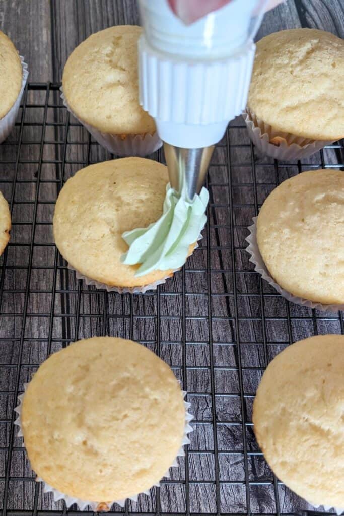 topping cupcakes with pistachio cool whip frosting