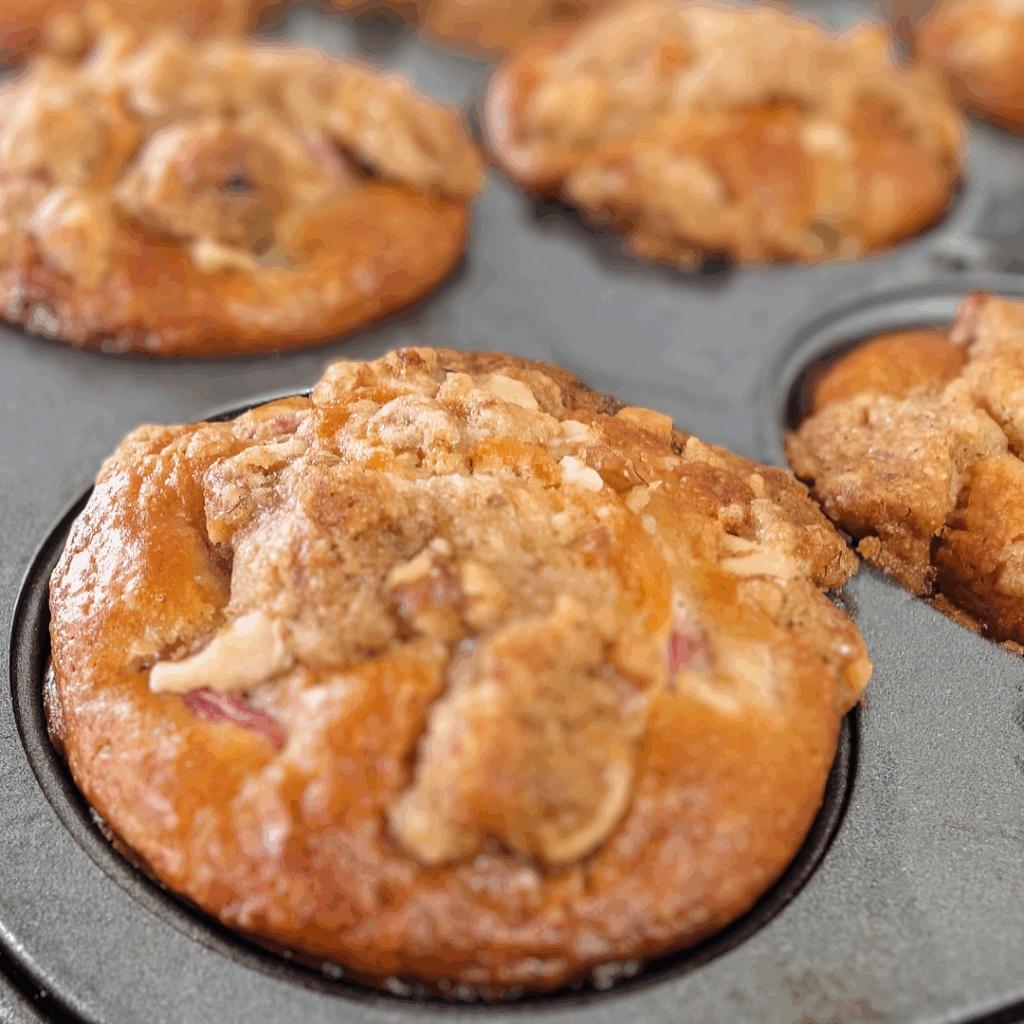close up side top view of muffins in pan