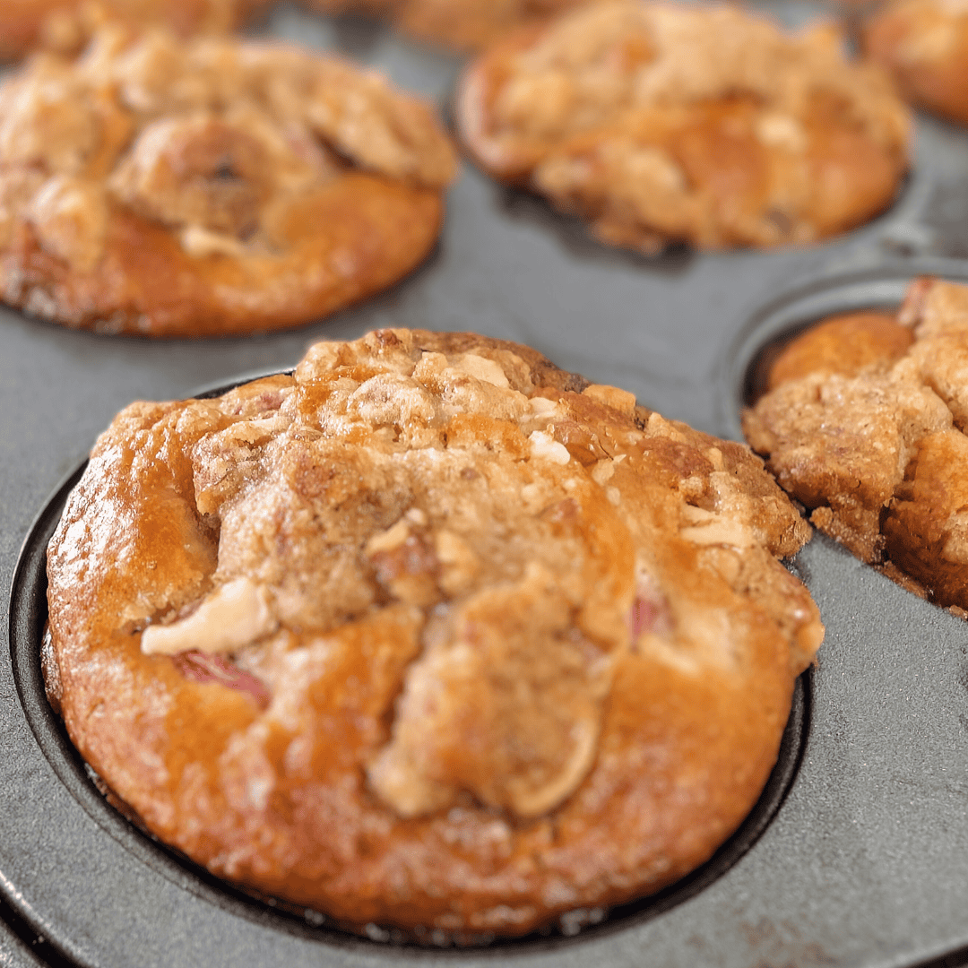 close up side top view of muffins in pan