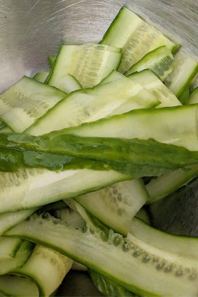 adding cucumber back to bowl