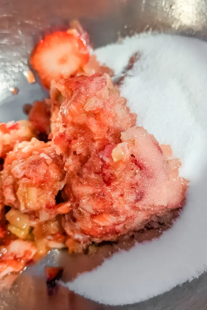 adding strawberry rhubarb to white sugar ice cream base