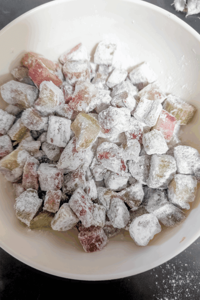 rhubarb dusted with flour in beige bowl
