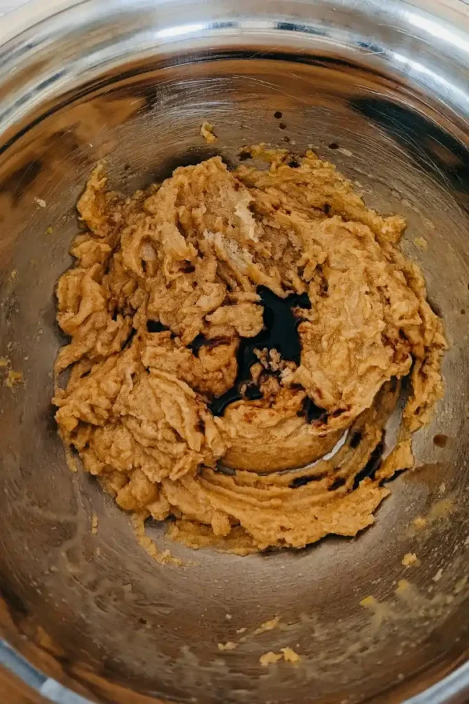 adding vanilla to creamed sugar mix