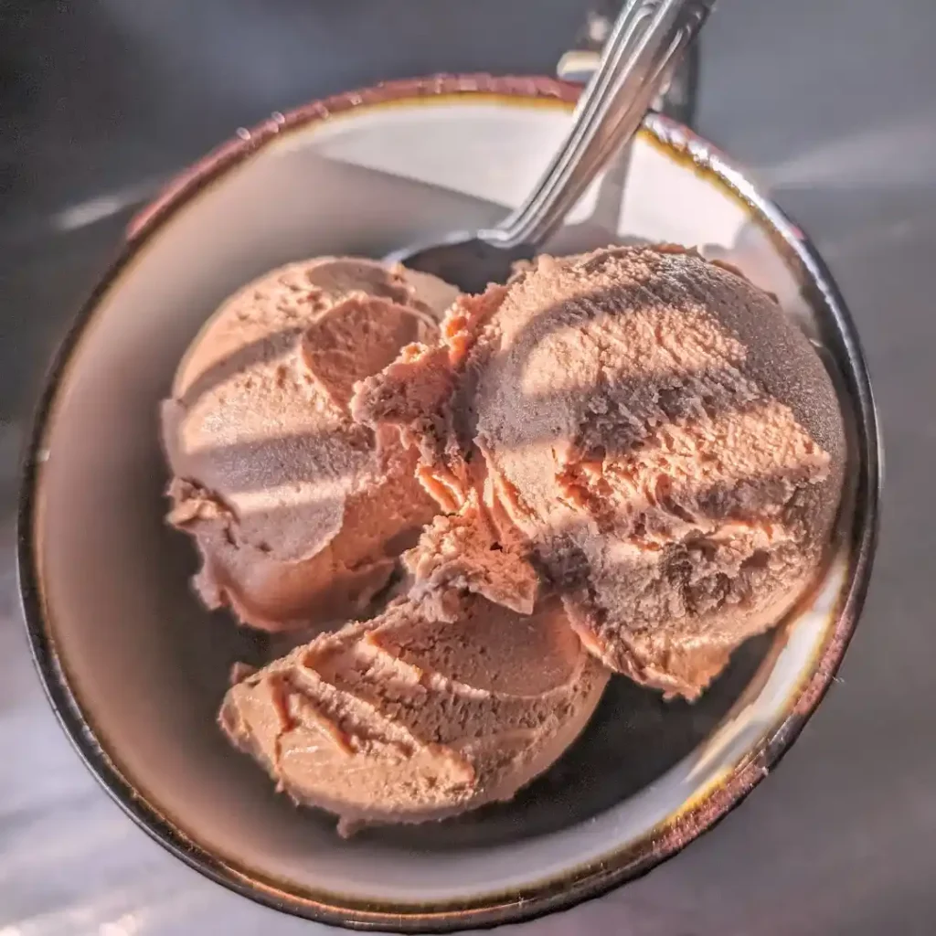 evening shadow and light on mocha nutella ice cream scooped into cup