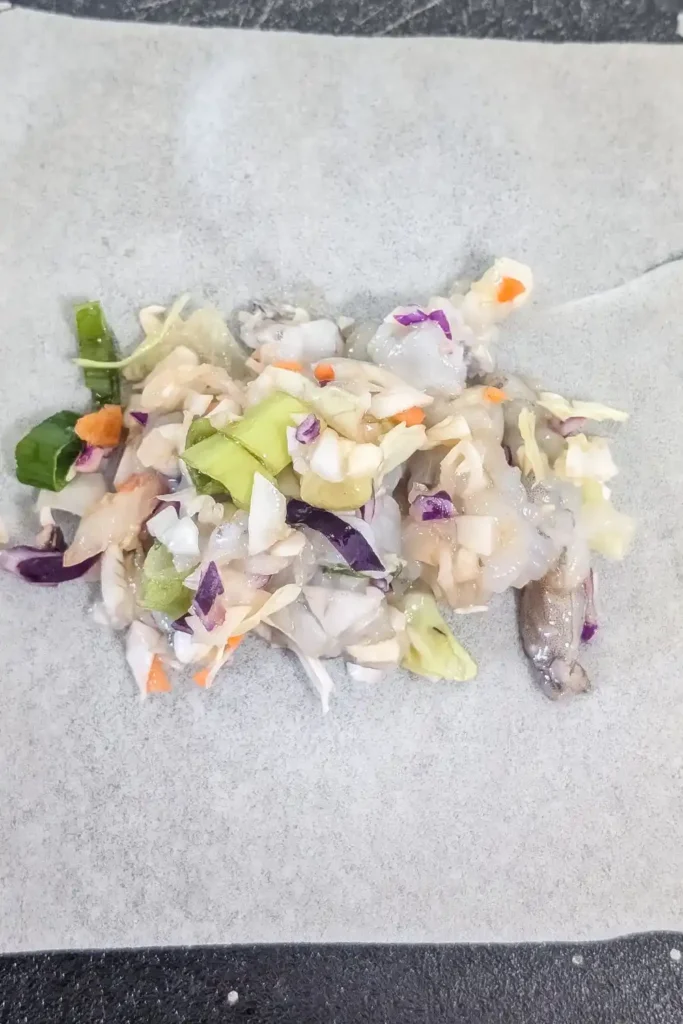 adding filling to spring roll wrapper