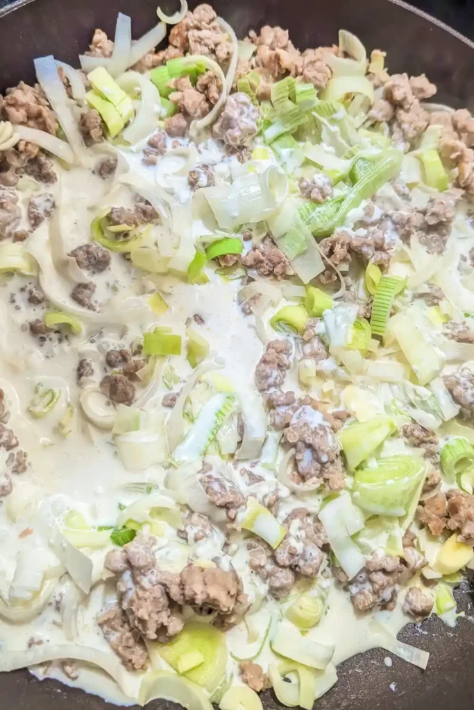 stiring the contents of the meat pie filling