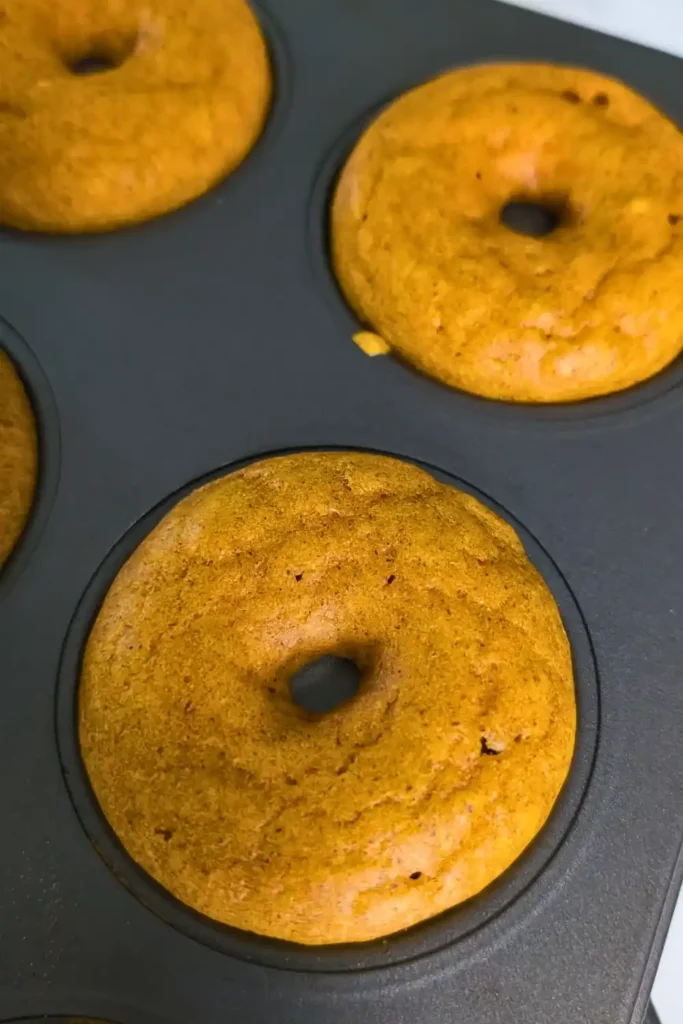 baked pumpkin donuts in donut pan