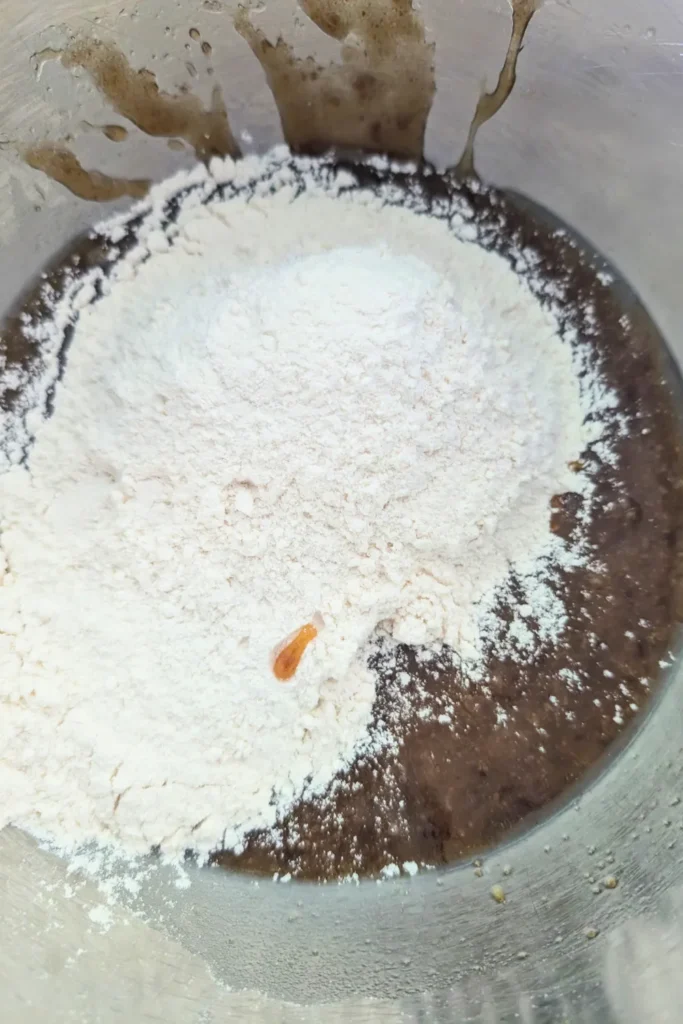 adding the flour and other dry ingredients to the wet ingredients