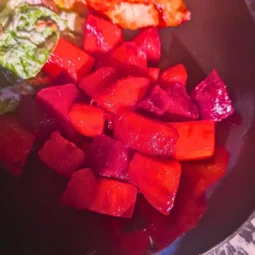easy air fryer roast beets with honey and pepper on edge of plate