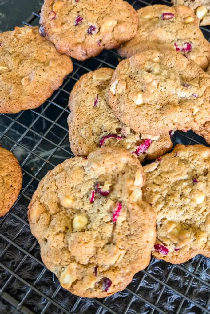 baked white chocolate cranberry cookies on wire rack willy nilly