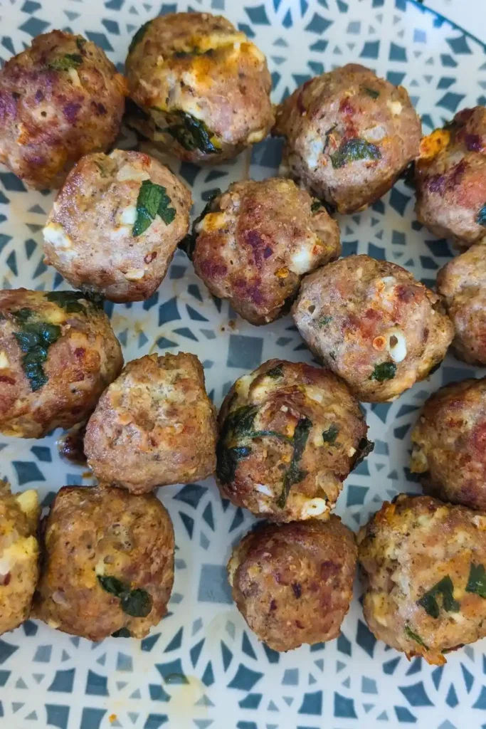 cooked turkey meatballs on blue and white patterned plate