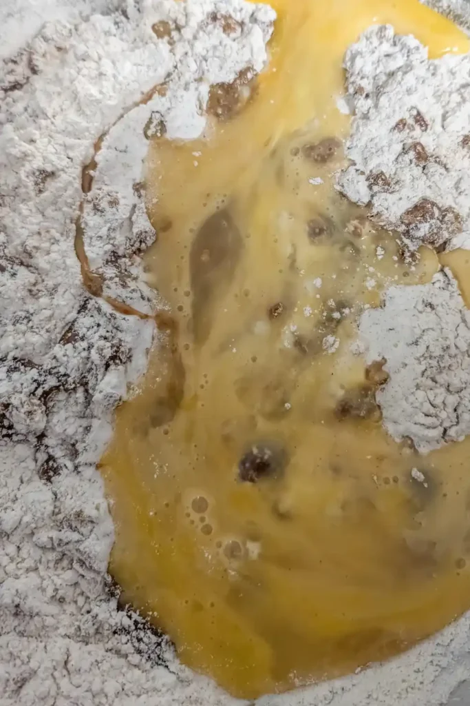 adding beaten eggs to the gingerbread batter