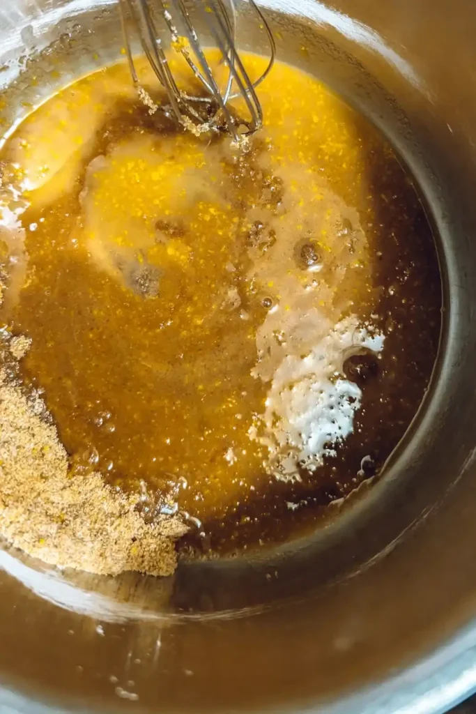whisking in the orange juice to orange sauce