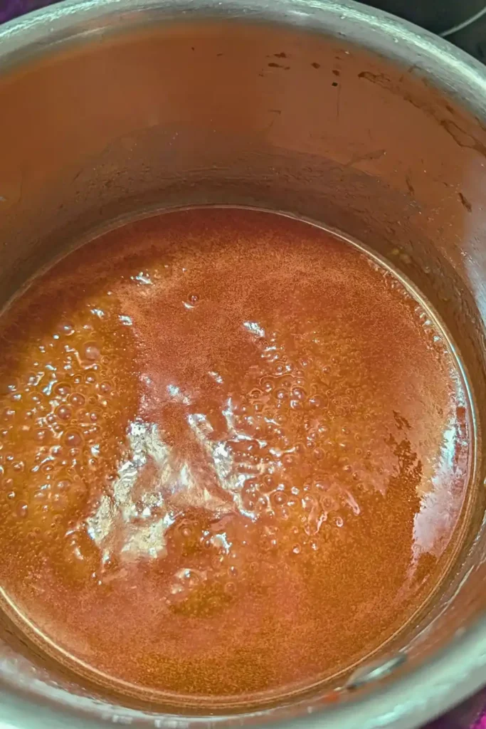 the sweet and sour sauce at a rolling boil