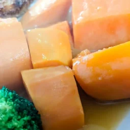 recipe card image of orange sauced sweet potatoes