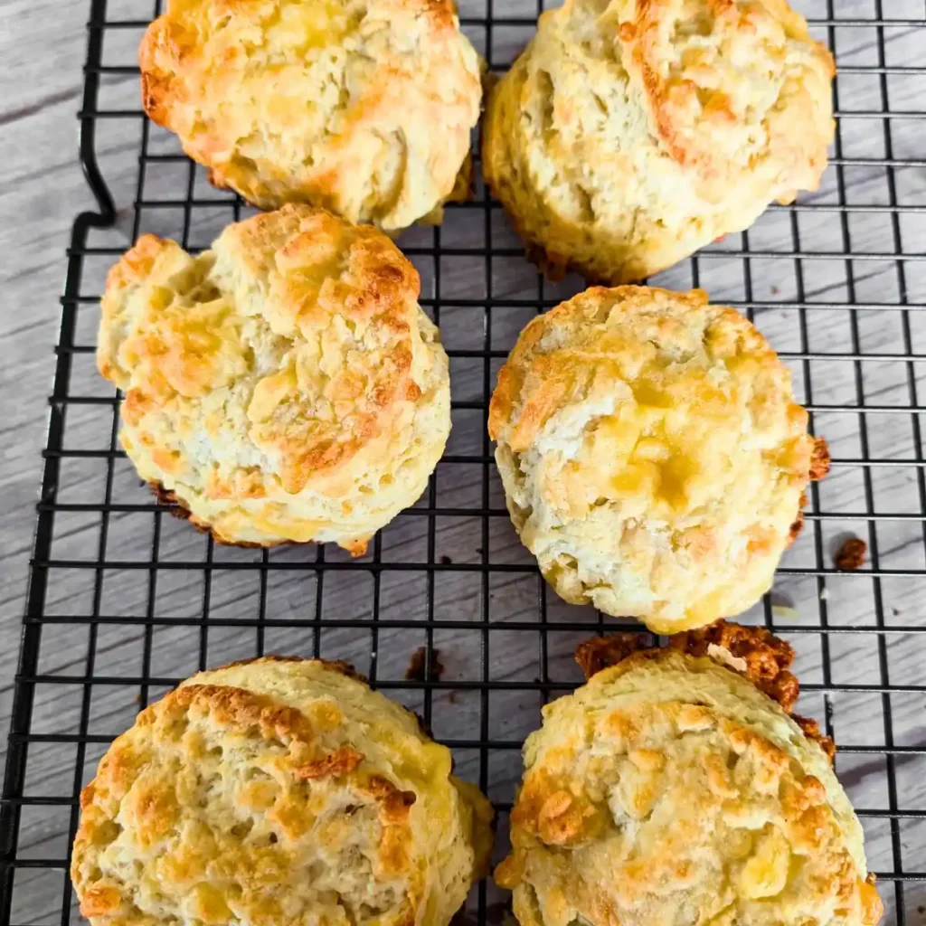 flaky cheese biscuits on baking rack