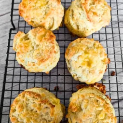 flaky cheese biscuits on baking rack