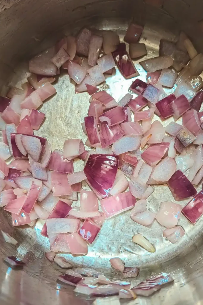 saute onions with garlic in stainless steel saucepan