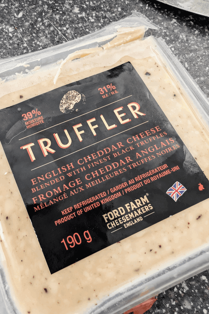 English truffler cheese with black truffles in package