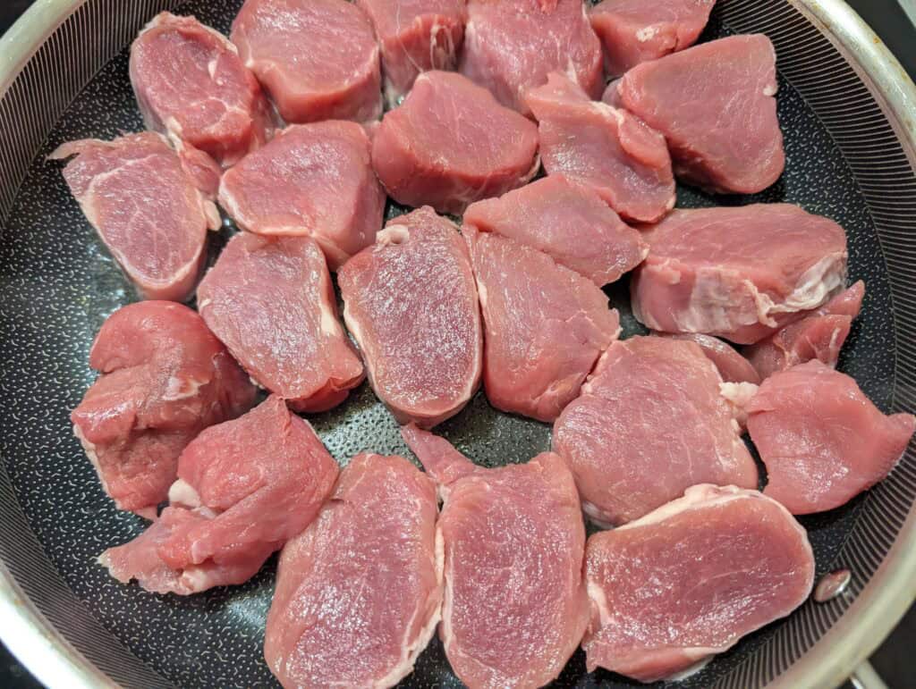 pork medallions in hot pan