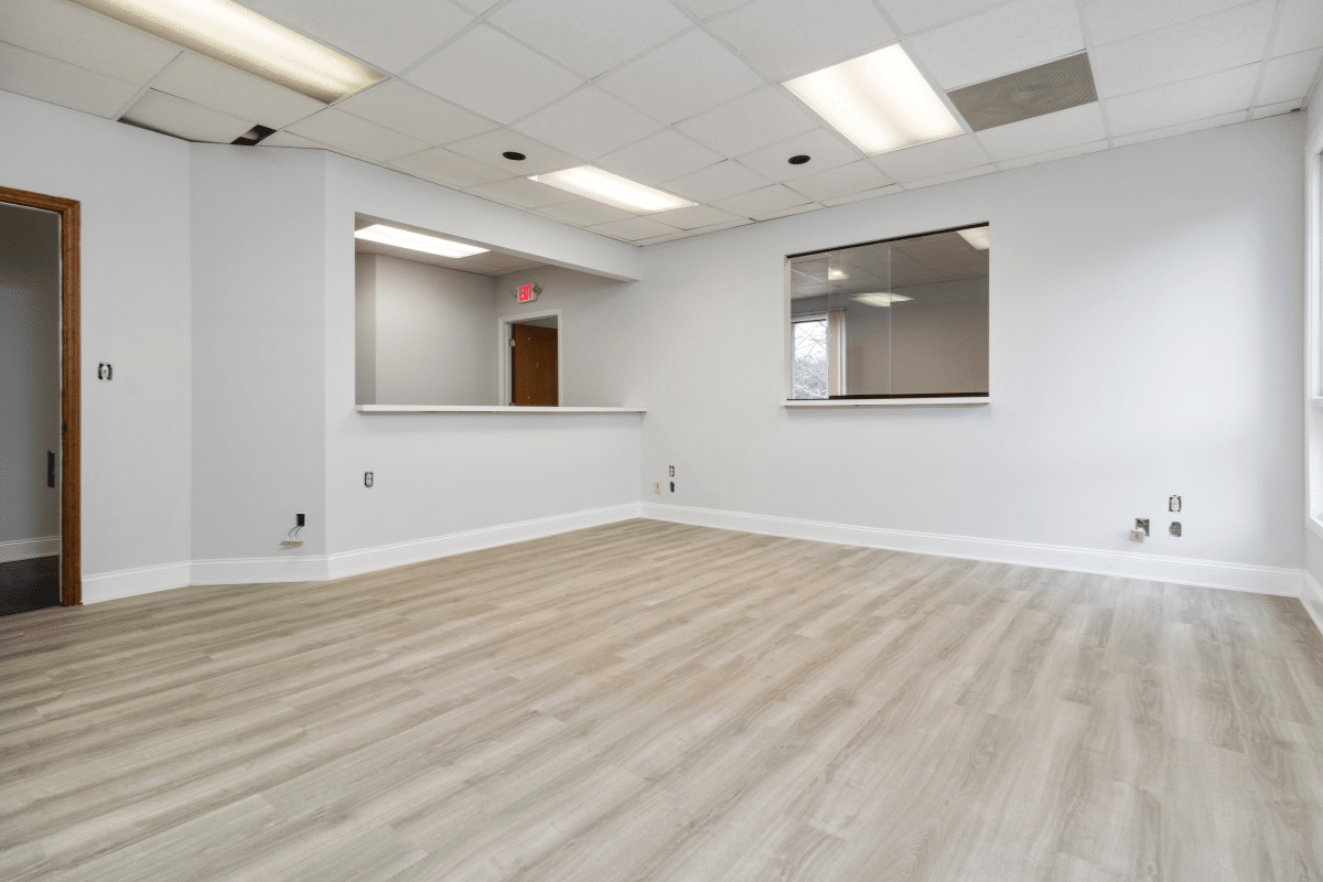 This unused office space from Chupps Interior Construction is ready for painting or updates. The area offers a clean and bright starting point, making it easy to imagine new ideas for the interior.
