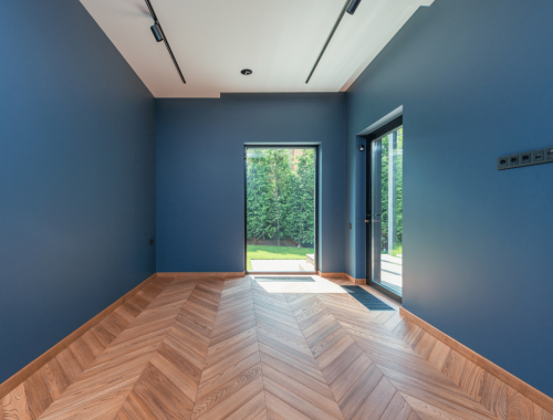 A bright, newly finished room by Chupps Interior Construction that looks welcoming and ready for use.