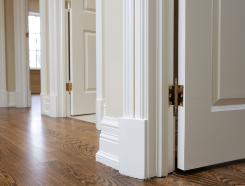 Image shows a well-built hallway by Chupps Interior Construction, highlighting quality doors and floors in natural light.