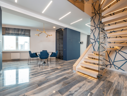 Chupps Interior Construction creates a modern, open space that feels bright and welcoming with stylish features and warm lighting.