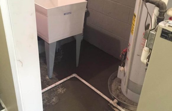A clean utility room ready for plumbing work by Cirigliano Plumbing LLC, showing easy access to pipes and fixtures.