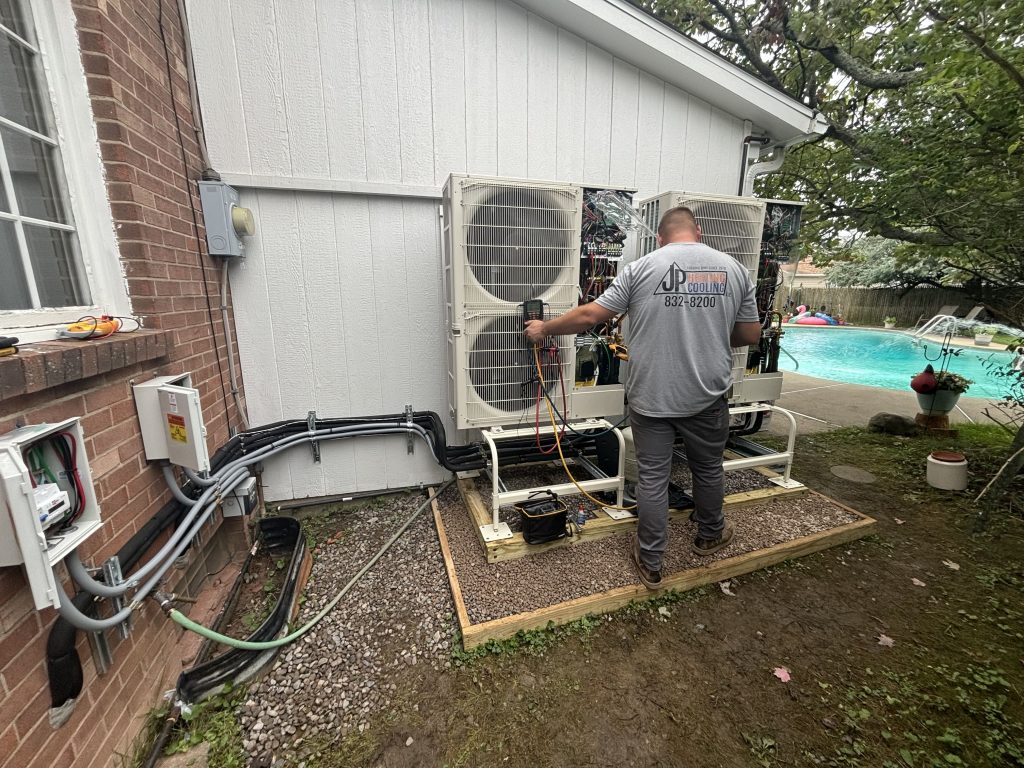 JP Heating & Cooling technician provides AC maintenance, keeping homes comfortable and systems running well.