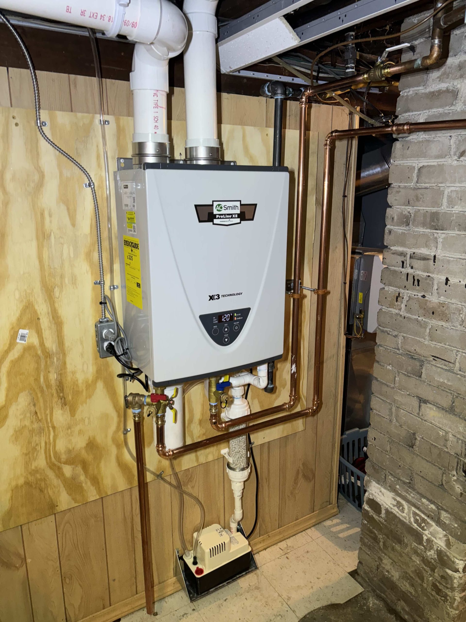 A tankless water heater installed by JP Heating & Cooling shows safe, modern home heating and water system work.