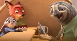A smiling sloth in a green shirt sits behind a desk, holding a tablet. A fox and a rabbit, both looking happy, are on the other side of the counter. A mug with writing is near the sloth.