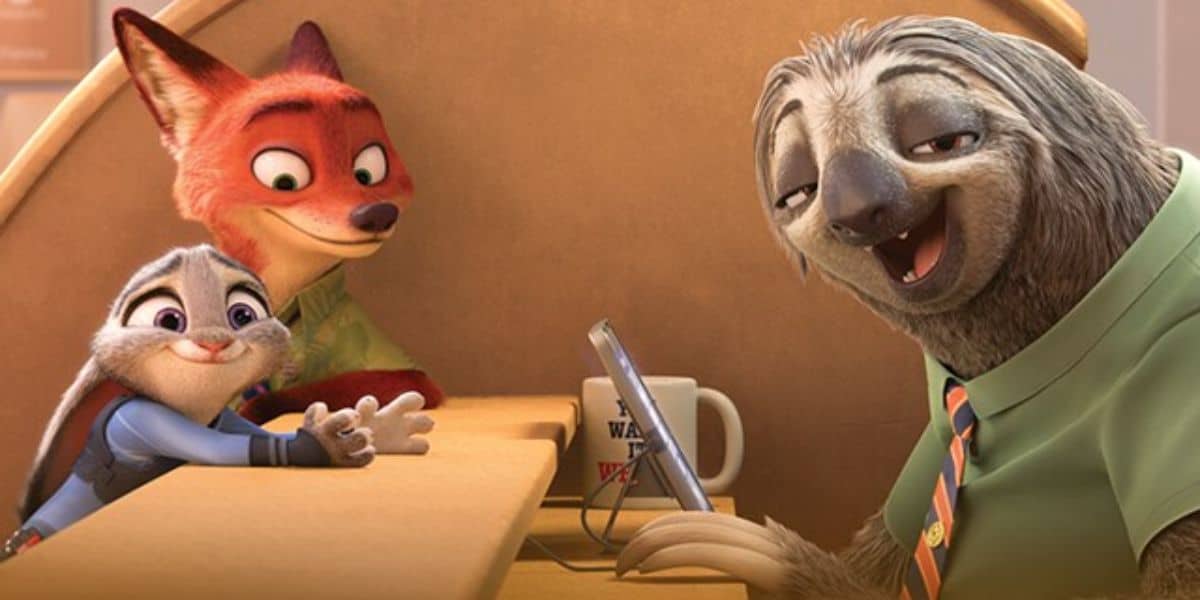 A smiling sloth in a green shirt sits behind a desk, holding a tablet. A fox and a rabbit, both looking happy, are on the other side of the counter. A mug with writing is near the sloth.