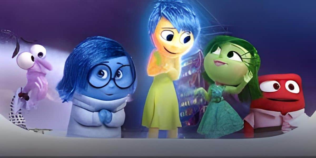 Animated characters from "Inside Out" represent different emotions. Sadness is blue and gloomy, Fear is purple and nervous, Joy is glowing and cheerful, Disgust is green and unimpressed, and Anger is red and fiery, standing together in a console room.