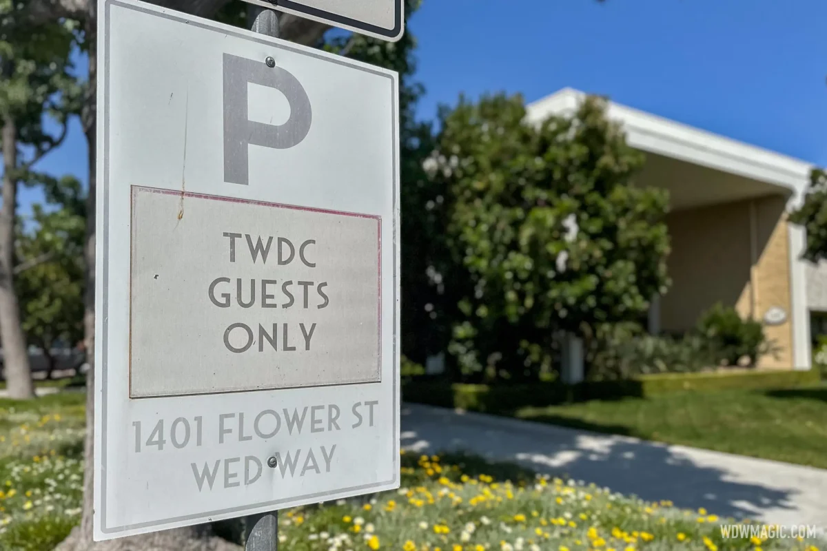 A sign reading "TWDC Guests Only, 1401 Flower St, Wedway"