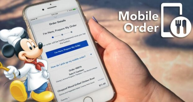 A hand holds a smartphone displaying the My Disney Experience App, where a food ordering interface is visible. Mickey Mouse, dressed as a chef, points with a wooden spoon. To the right, "Mobile Order" appears next to a stylized fork and spoon icon.