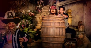 Pirates of the Caribbean ride Johnny Depp animatronic in a barrel, next to the real Johnny Depp