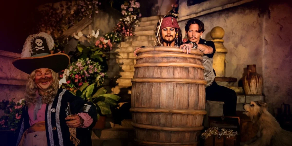Pirates of the Caribbean ride Johnny Depp animatronic in a barrel, next to the real Johnny Depp
