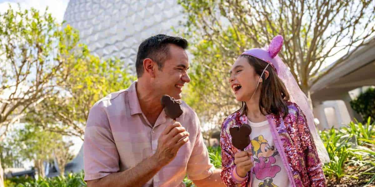 Father and Daughter eating Ice cream bars at EPCOT