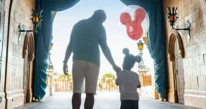 Dad and child walking through castle