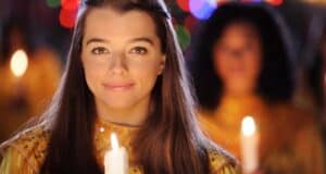 Girl holding candle at EPCOT Processional