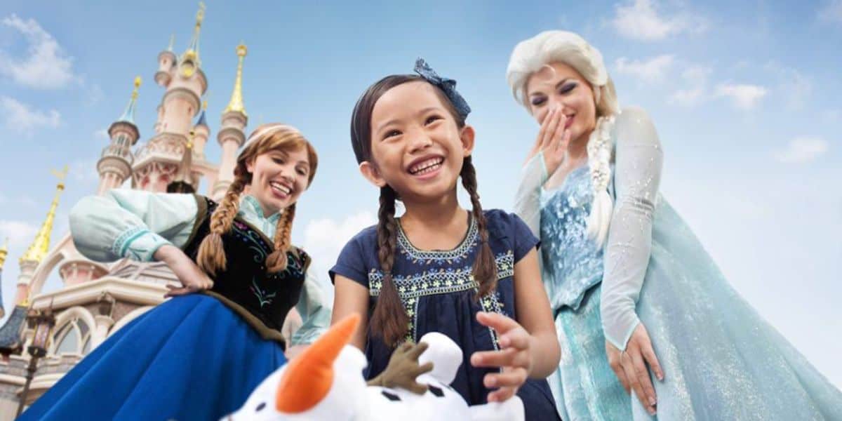 Disneyland Paris guest with Anna and Elsa